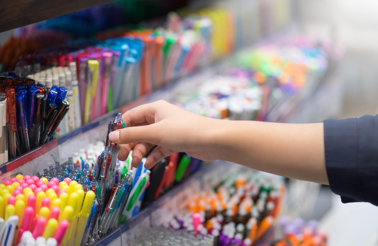 rows of pens and markers at a school store