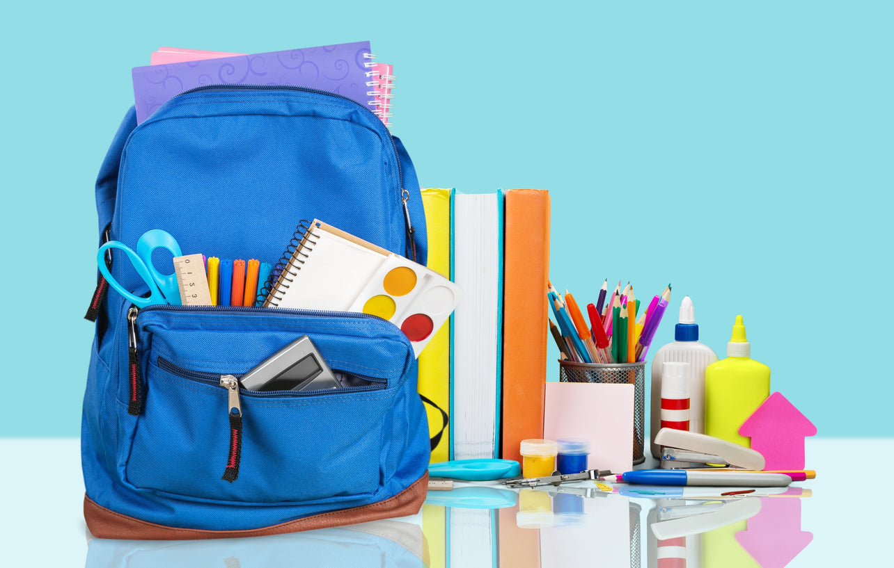 blue book bag with colorful school supplies