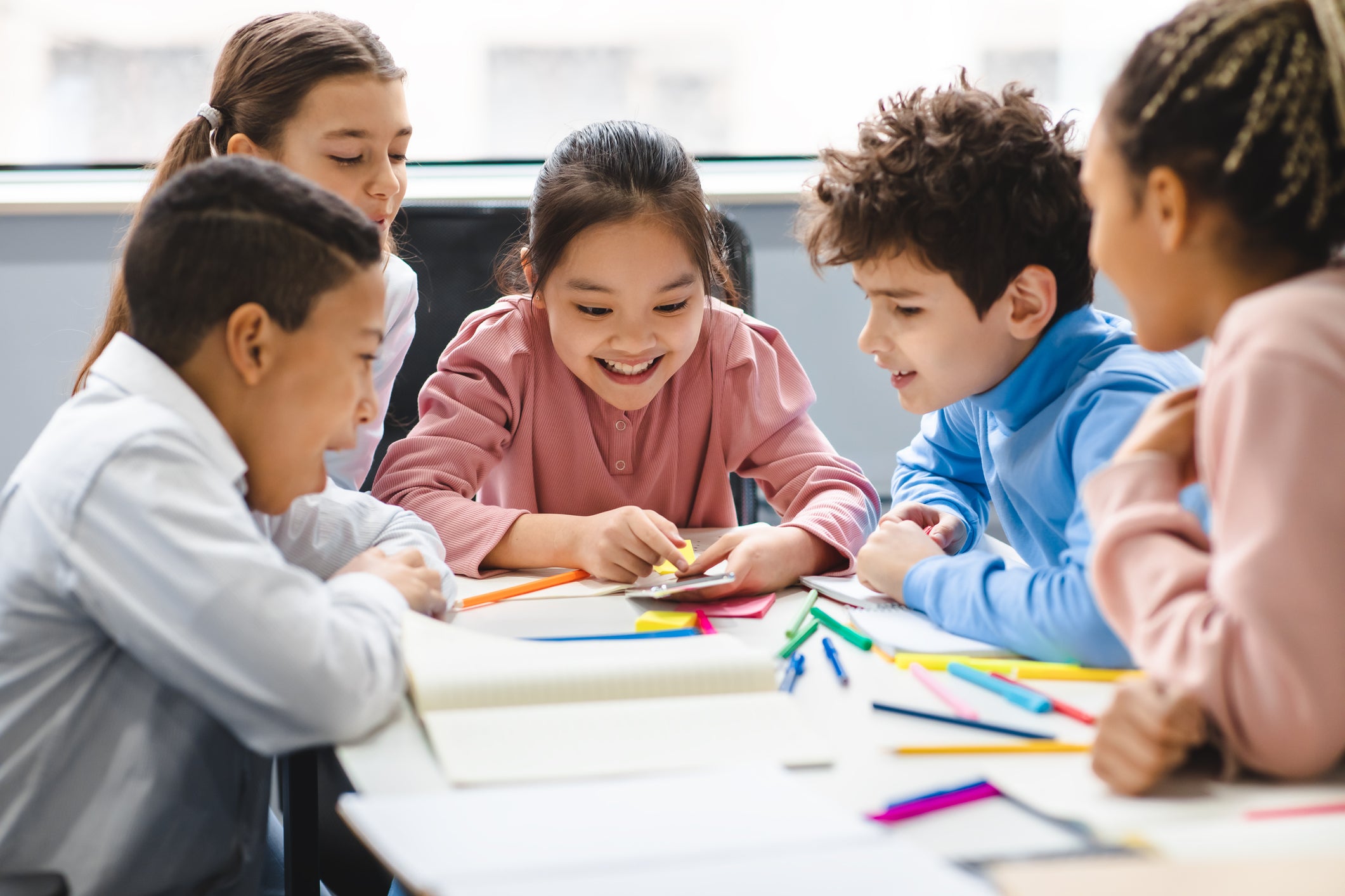 group of children playing a game in the classroom