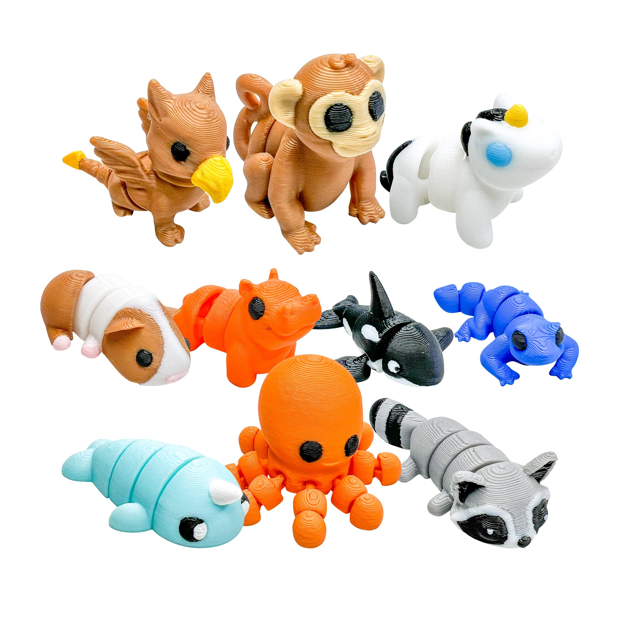 Ten colorful 3D Printed Squiggly Jiggly Pets figures featuring Merv, Coconut, Stardust, Igor, Buttercup, Echo, Lizzo, Bluebell, Bubbles and Bandit on a white background.