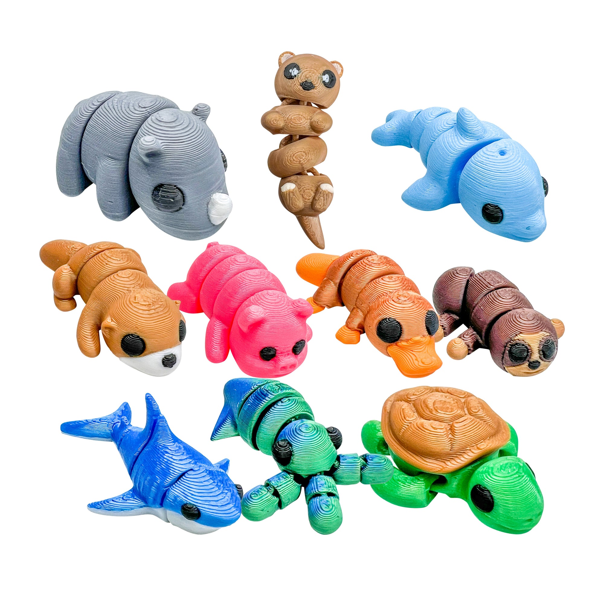 Ten colorful 3D Printed Squiggly Jiggly Pets figures featuring Thunder, Cody, Giggles, Fuzzy, Lulu, Puddles, Choco, Chomp, Squirt and Tiny on a white background.
