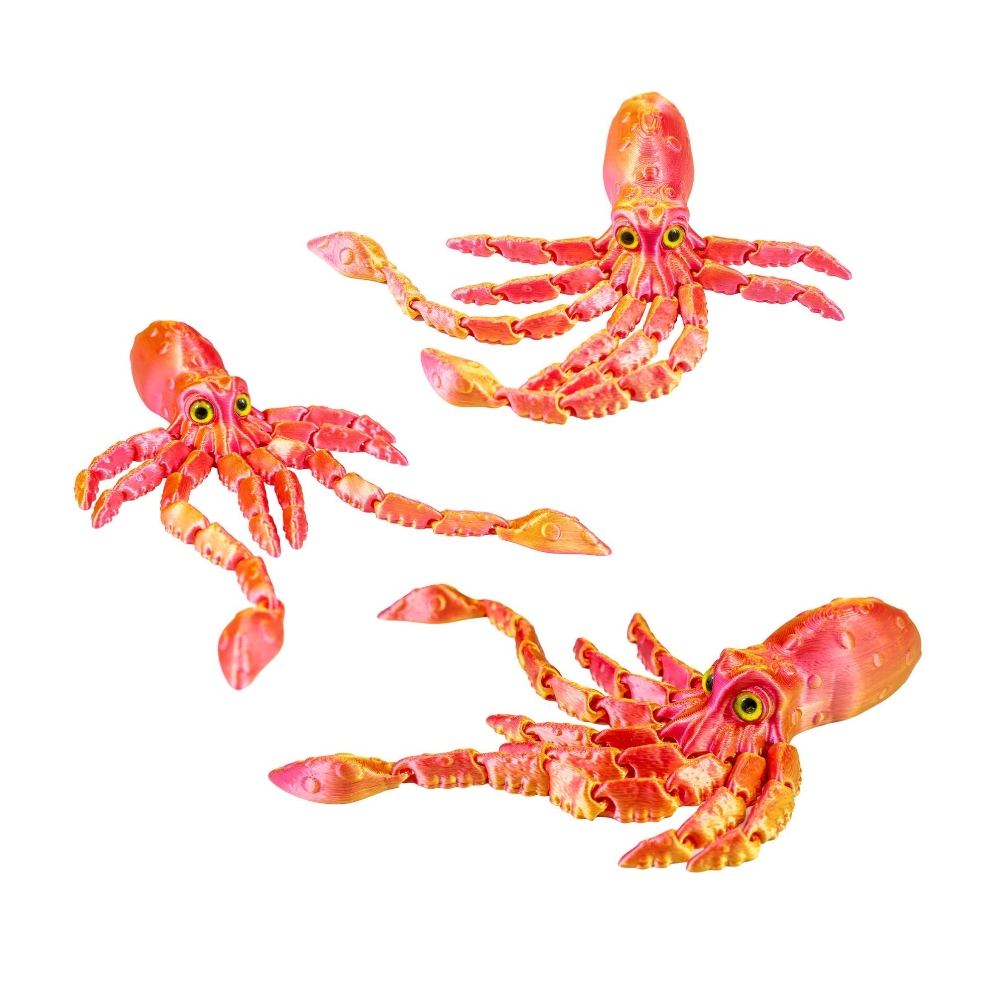 Three orange and pink 3D-printed squid fidget toys arranged in different poses on a plain white background.