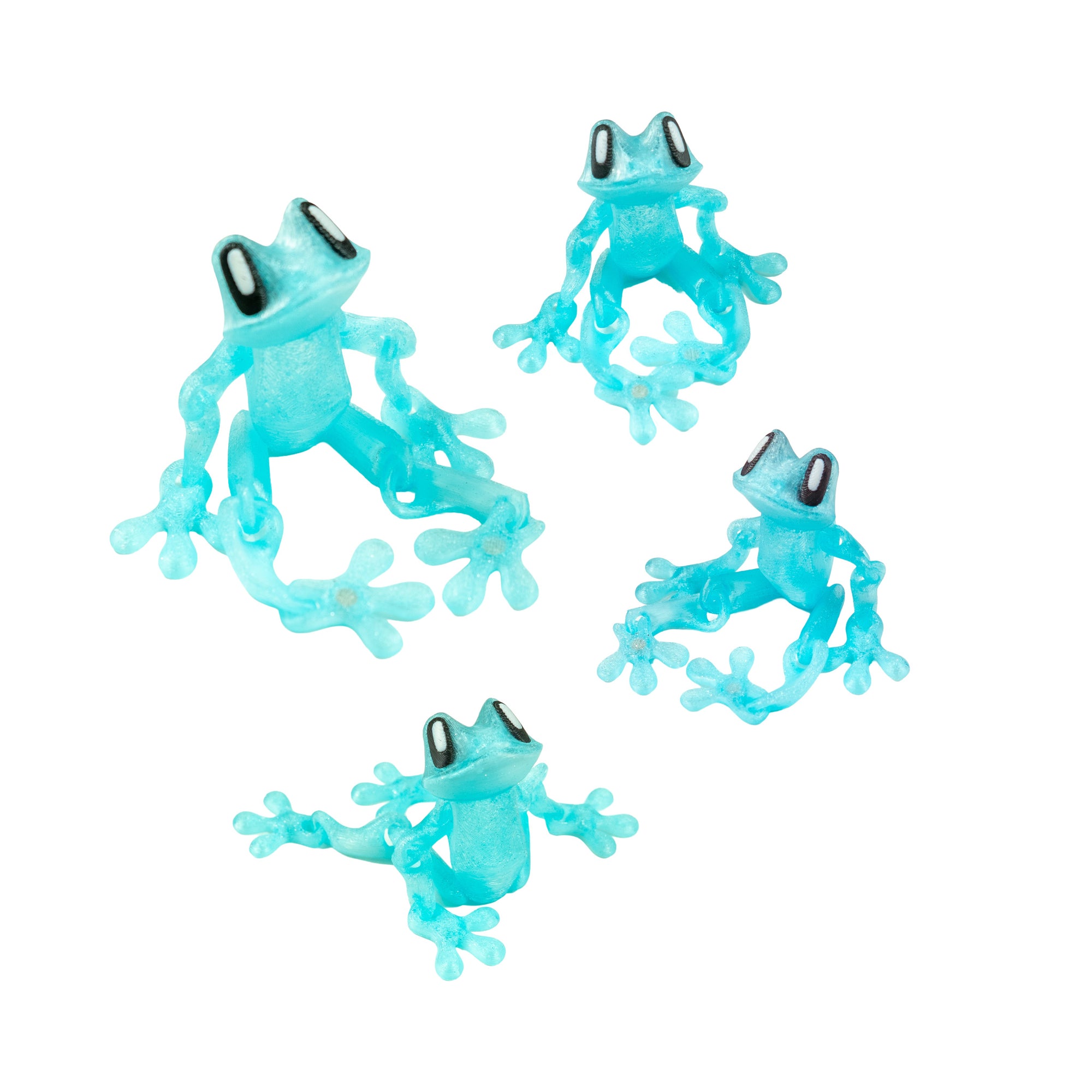 our sparkly light blue 3D Printed Magnetic Frog Locker Buddies shown in different articulated poses.