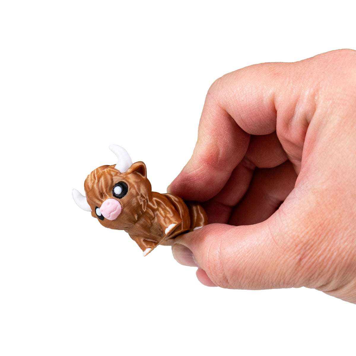 Hand holding dark brown Moose and demonstrating the articulated movement of the 3D Printed Highland Cow Fidget.